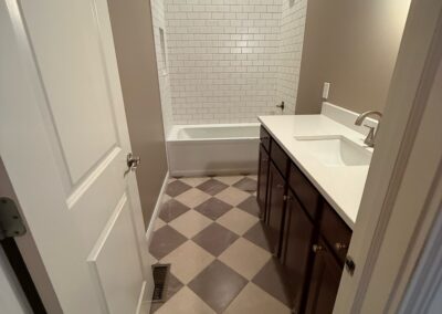 Bathroom remodel with checkerboard floor