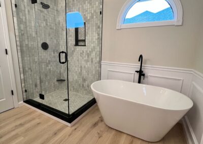 Bathroom remodel with glass shower and freestanding tub