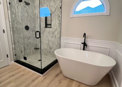 Bathroom remodel with glass shower and freestanding tub